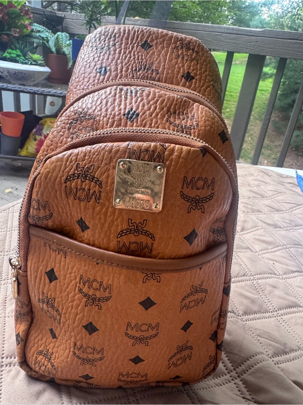 MCM Cognac Brown Logo Leather Sling Backpack with Gold Plaque